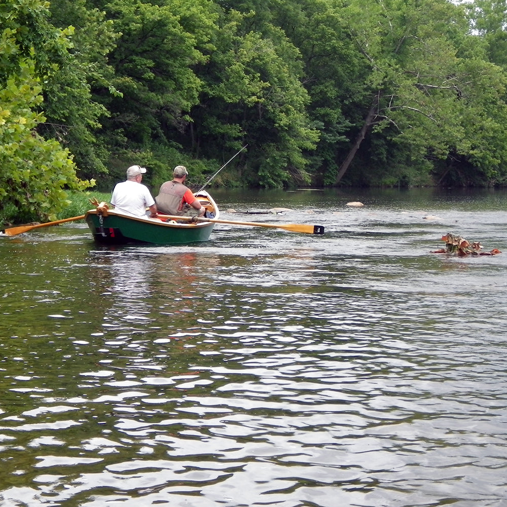 Two fly fishermen Floating the Shenandoah River in a locally made wooden drift boat